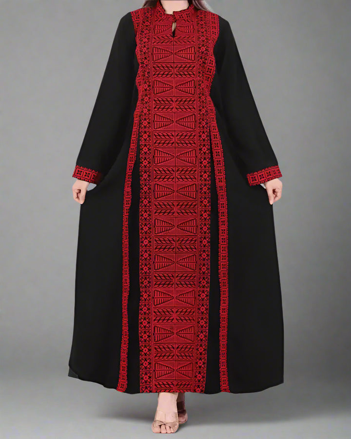Black Palestinian abaya with gold, white, and red etamine embroidery, blending traditional Palestinian and Moroccan design, made from premium Saudi crepe fabric